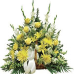 cesto funebre di rose e fiori gialli